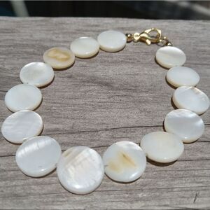 Flat beads beaded bracelet with gold toned hardware